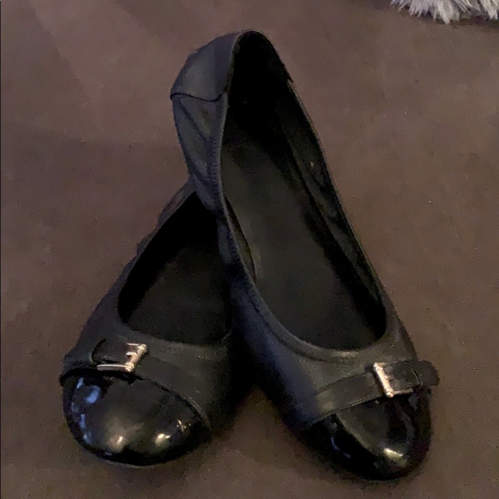 Cole Haan flats.  Essential black flats